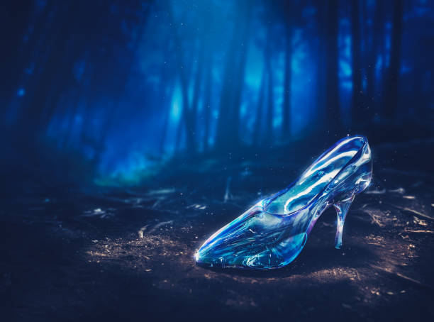 Glass slipper on a reflective surface symbolizing transformation, destiny, and the Cinderella fairy tale.